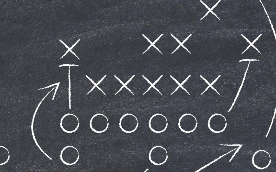 Football strategy on blackboard, close-up